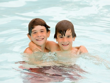 happy kids swimming
